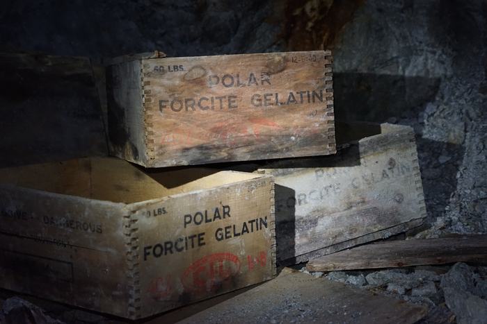 Wooden Polar Forcite Gelatin dynamite boxes stacked in an abandoned mine