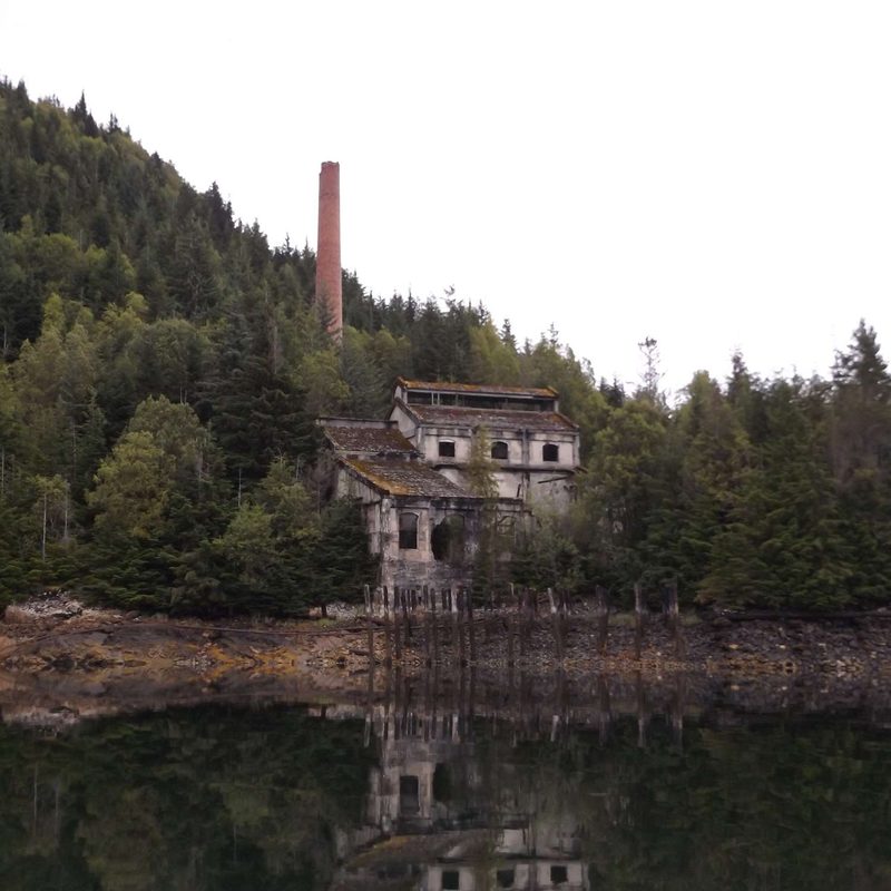 The ruined powerhouse at Anyox and its brick stack, on the cover of the record
