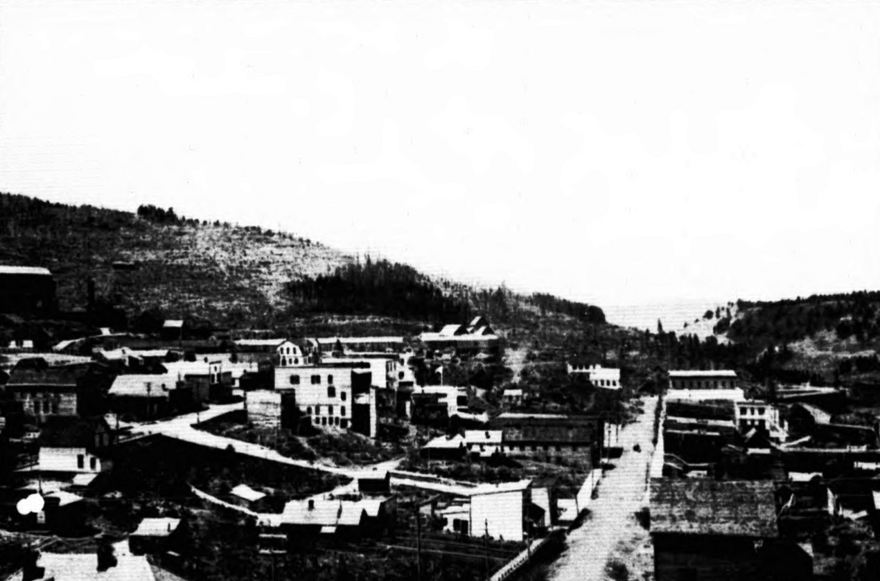 Phoenix, BC, looking west in 1909: the main street running down between frame hotels, stores and houses, with the logged hillside behind
