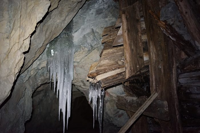 Icicles hanging beside the broken timbering of an old ore chute at Phoenix