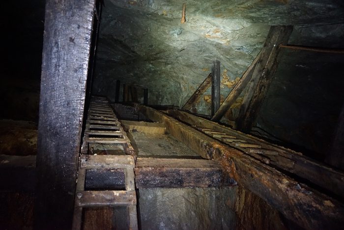A ladder still standing against heavy chute timbering at Phoenix