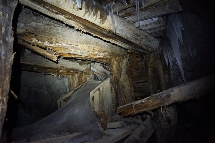 Collapsed timbers and hanging ice in an old stope at Phoenix