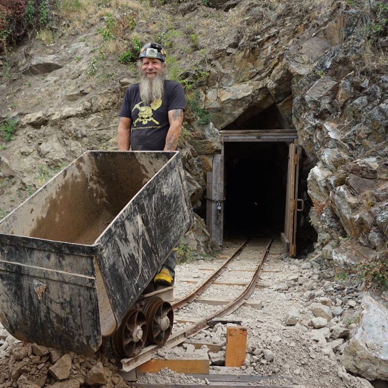Frank behind an ore car at the Yankee Boy portal, on the cover of the record